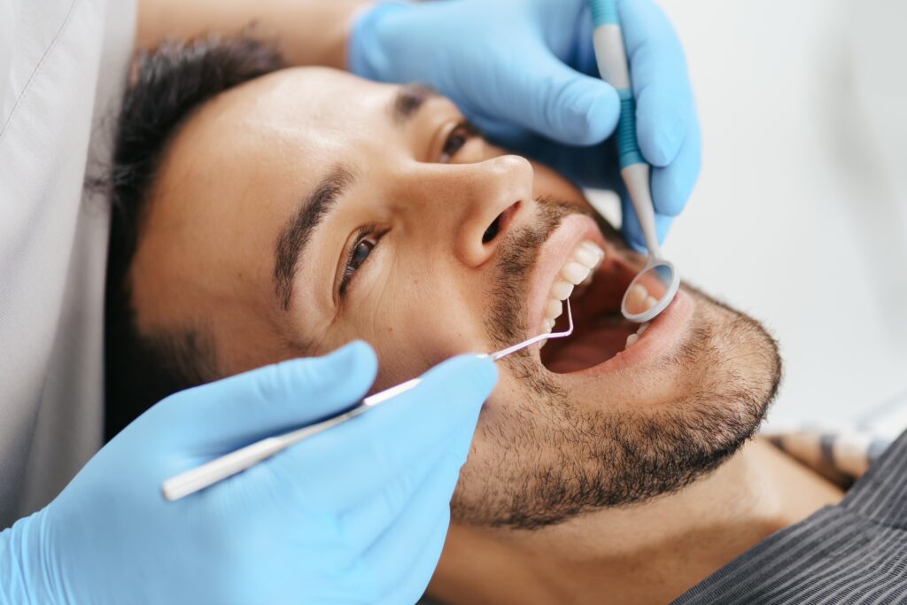 Close-up of a content patient undergoing a dental procedure, highlighting the importance of regular dental care