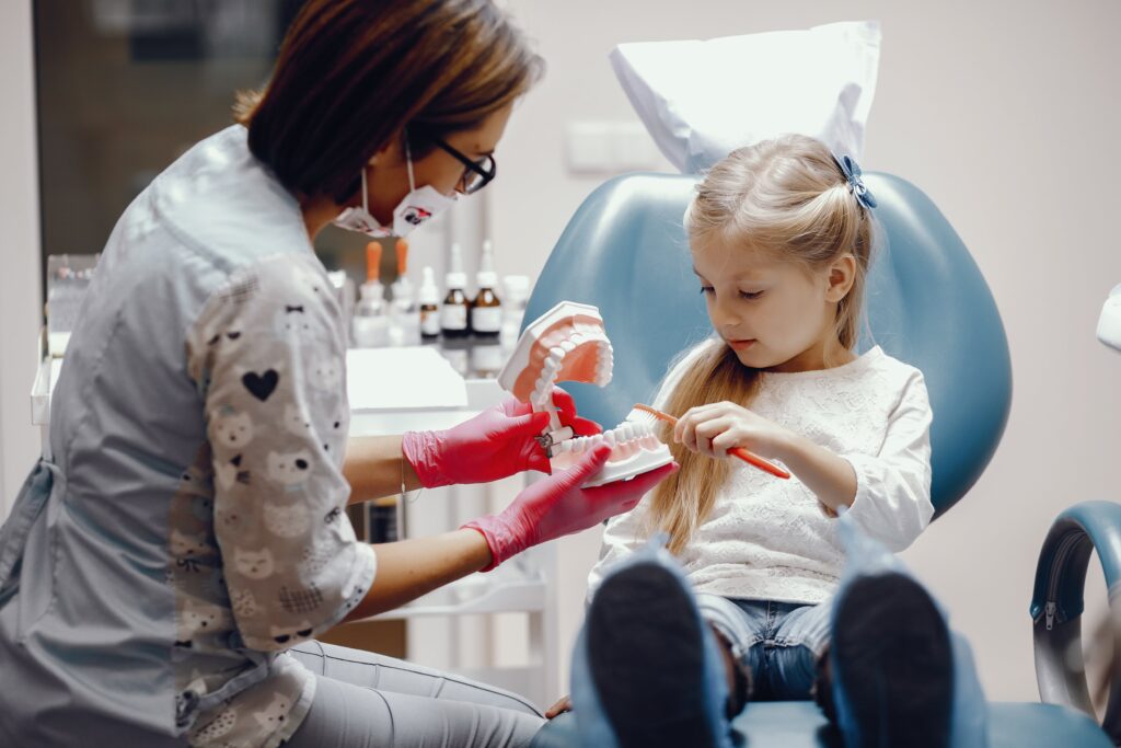cute-little-girl-sitting-dentist-s-office (1)-min