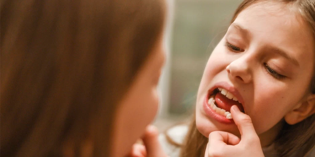 girl with loose tooth